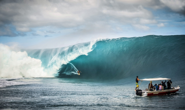 Raimana Vanbastolaer rides the wave at Teahupoʻo